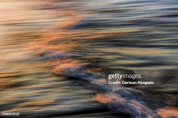 panning the wave - abogado stock pictures, royalty-free photos & images