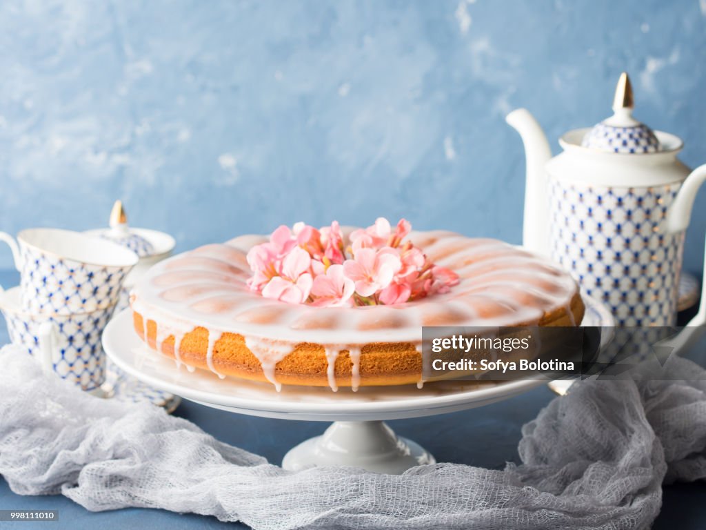 Bundt cake with frosting. Festive treat spring flowers