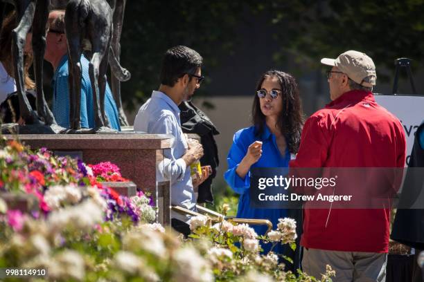 Sundar Pichai, chief executive officer of Google, talks with Mala Gaonkar, managing director at Lone Pine Capital, during the annual Allen & Company...