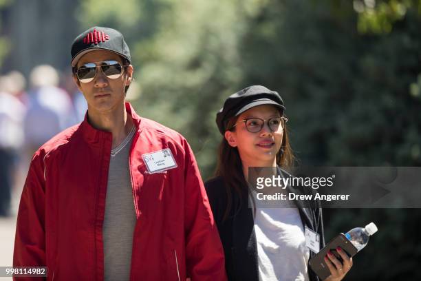 Singer, actor and producer Wang Leehom walks with his wife Lee Jinglei during the annual Allen & Company Sun Valley Conference, July 13, 2018 in Sun...