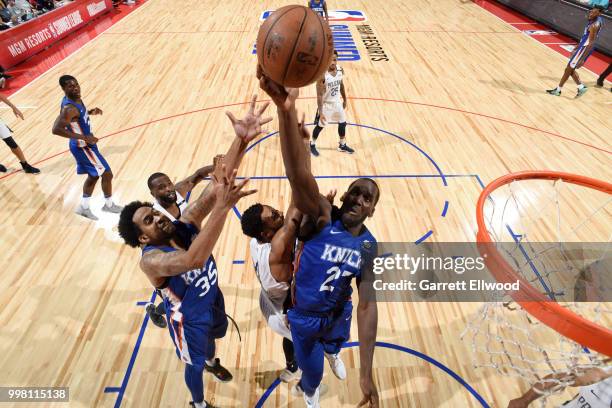 Daniel Ochefu of the New York Knicks drives to the basket during the game against the New Orleans Pelicans during the 2018 Las Vegas Summer League on...