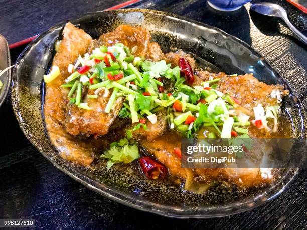 scabbard fish braised in soy sauce served at lunch - ray finned fish stock-fotos und bilder