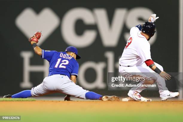 Rougned Odor of the Texas Rangers stretches to make the out at second base in the sixth inning of a game against the Boston Red Sox at Fenway Park on...