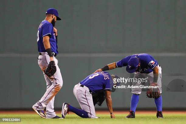 Delino DeShields of the Texas Rangers reacts after injuring himself in the sixth inning of a gam against the Boston Red Sox at Fenway Park on July...