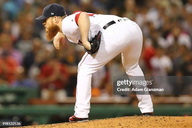 Craig Kimbrel of the Boston Red Sox pitches in the eighth inning of a game against the Texas Rangers at Fenway Park on July 11, 2018 in Boston,...
