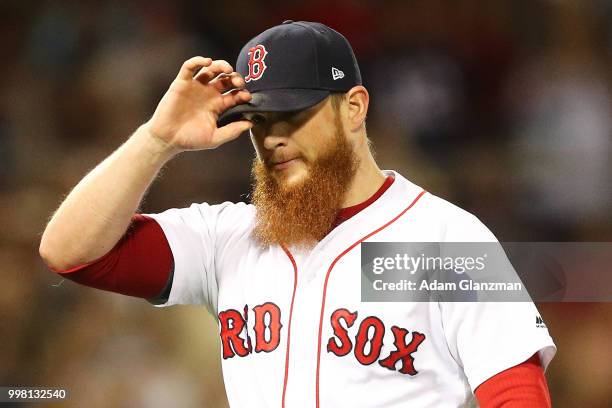Craig Kimbrel of the Boston Red Sox reacts after making the this out in the eighth inning of a game against the Texas Rangers at Fenway Park on July...