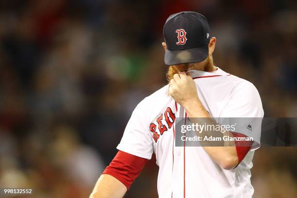 Craig Kimbrel of the Boston Red Sox reacts after making the this out in the eighth inning of a game against the Texas Rangers at Fenway Park on July...