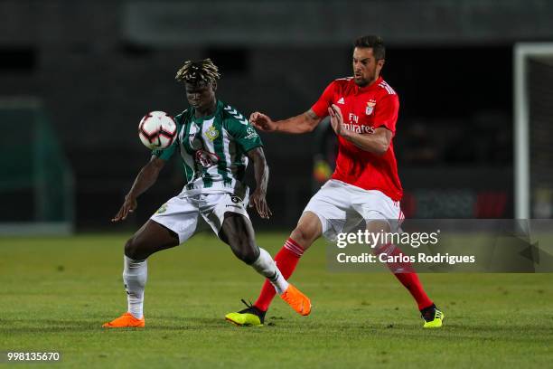 Vitoria Setubal forward Valdu Te from Guinea Bissau vies with SL Benfica defender Jardel from Brazil for the ball possession during the match between...