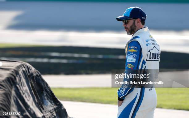 Jimmie Johnson, driver of the Lowe's/Jimmie Johnson Foundation Chevrolet, stands on the grid during qualifying for the Monster Energy NASCAR Cup...