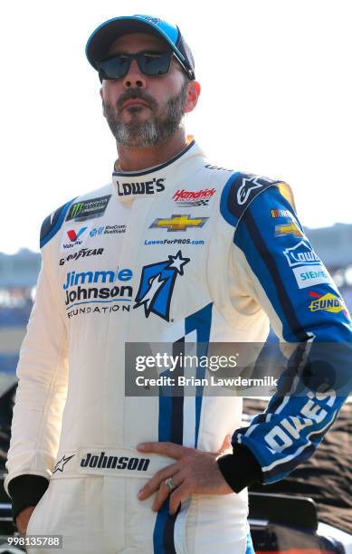 Jimmie Johnson, driver of the Lowe's/Jimmie Johnson Foundation Chevrolet, stands on the grid during qualifying for the Monster Energy NASCAR Cup...