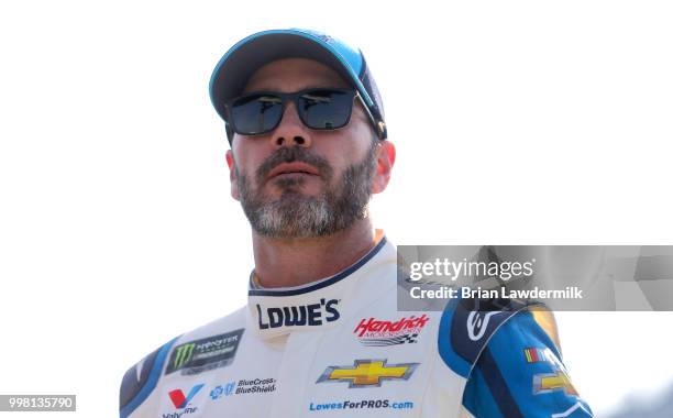 Jimmie Johnson, driver of the Lowe's/Jimmie Johnson Foundation Chevrolet, stands on the grid during qualifying for the Monster Energy NASCAR Cup...