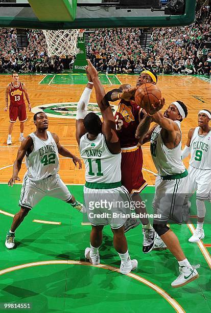 LeBron James of the Cleveland Cavaliers battles to shoot between Glen Davis and Rasheed Wallace of the Boston Celtics in Game Four of the Eastern...