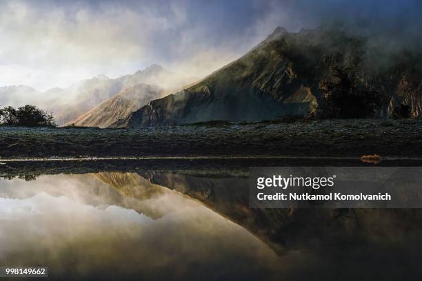 reflection of mountain in nubra valley - nubra valley stock pictures, royalty-free photos & images