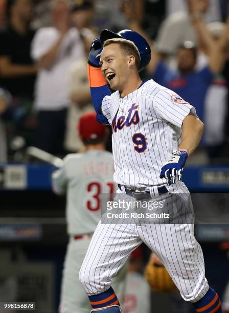 Brandon Nimmo of the New York Mets reacts after hitting a 10th inning pinch-hit walk-off home run off Mark Leiter Jr. #31 of the Philadelphia...