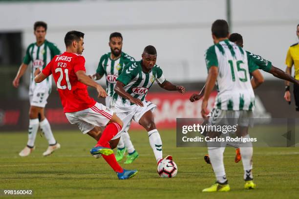 Benfica midfielder Pizzi from Portugal vies with Vitoria Setubal defender Vasco Fernandes from Portugal for the ball possession during the match...