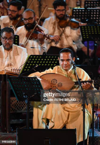 Tunisian singer Zied Gharsa performs the musical show "from Carthage to Seville" during the opening of the 54th edition of the International Carthage...