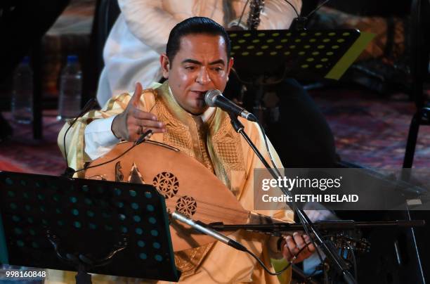 Tunisian singer Zied Gharsa performs the musical show "from Carthage to Seville" during the opening of the 54th edition of the International Carthage...