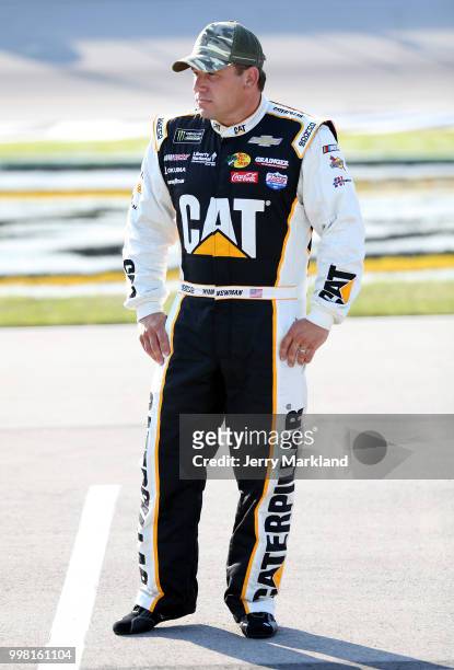 Ryan Newman, driver of the Caterpillar Chevrolet, stands on the grid during qualifying for the NASCAR Xfinity Series Alsco 300 at Kentucky Speedway...