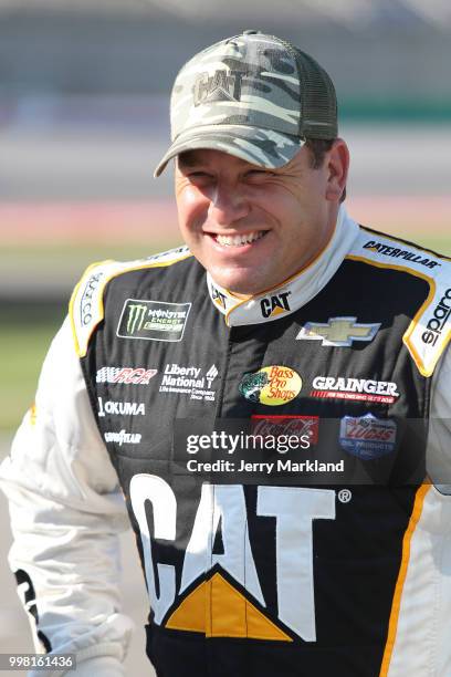 Ryan Newman, driver of the Caterpillar Chevrolet, stands on the grid during qualifying for the NASCAR Xfinity Series Alsco 300 at Kentucky Speedway...