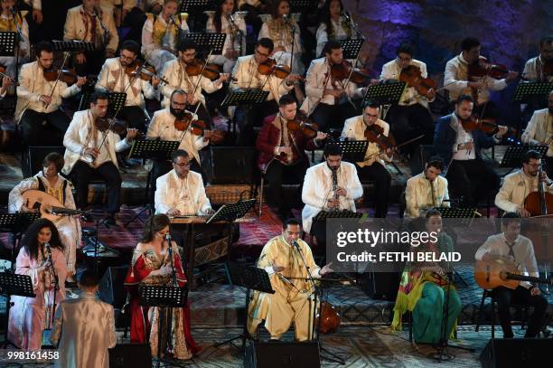 Tunisian singer Zied Gharsa performs the musical show "from Carthage to Seville" during the opening of the 54th edition of the International Carthage...