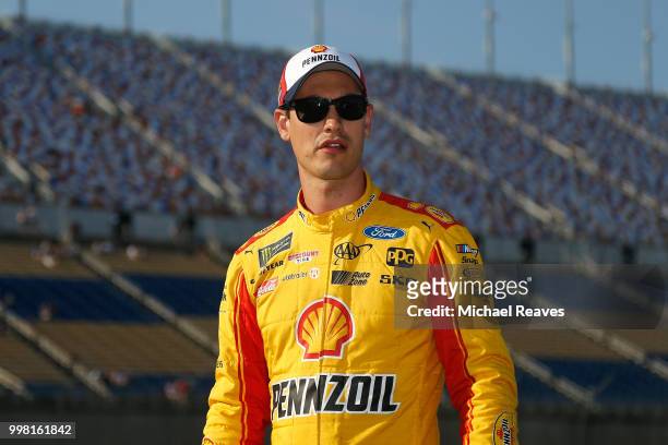 Joey Logano, driver of the Shell Pennzoil Ford, walks on the grid during qualifying for the Monster Energy NASCAR Cup Series Quaker State 400...