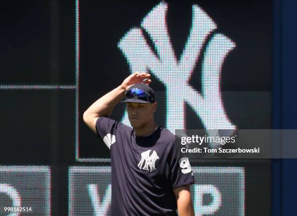 Aaron Judge of the New York Yankees looks on from right field during batting practice before the start of MLB game action against the Toronto Blue...