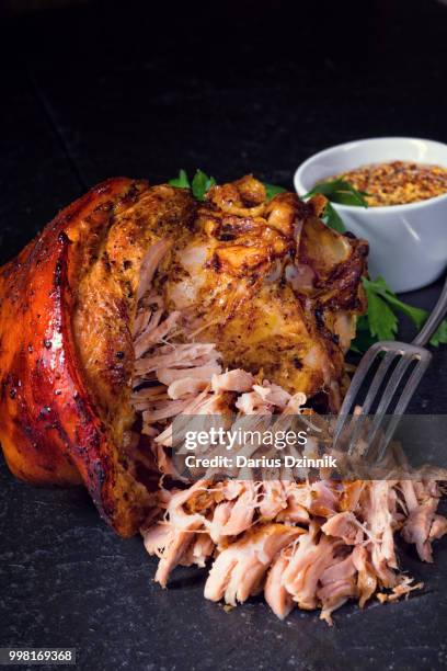 fresh roasted knuckle of pork with mustard - mustard stock-fotos und bilder