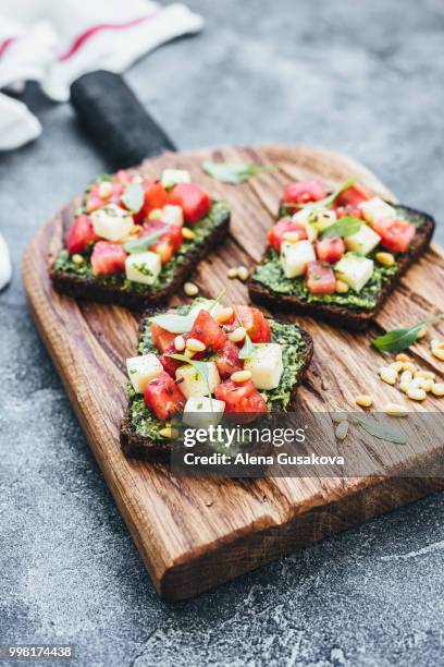 sandwich with pesto mozzarella and tomatoes - pesto stock pictures, royalty-free photos & images