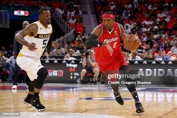 Derrick Byars of Trilogy dribbles the ball while being guarded by Stephen Jackson of the Killer 3's during BIG3 - Week Four at Little Caesars Arena...