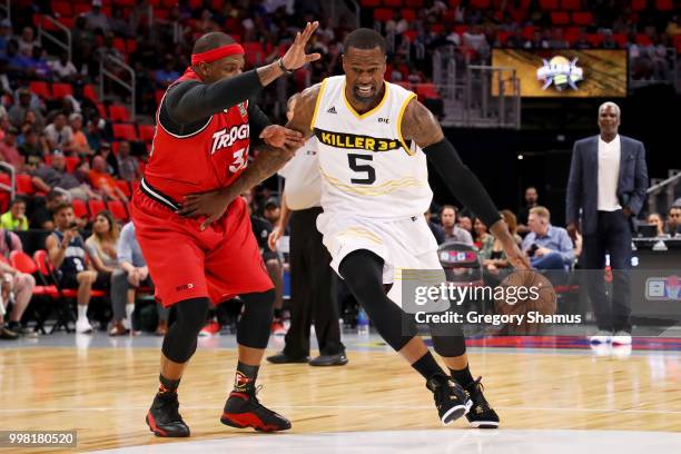 Stephen Jackson of the Killer 3's dribbles the ball while being guarded by Rashad McCants of Trilogy during BIG3 - Week Four at Little Caesars Arena...