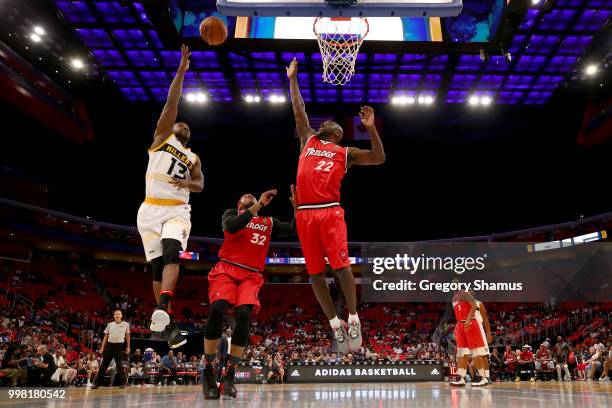 Mike James of the Killer 3's attempts a shot while being guarded by Rashad McCants and Dion Glover of Trilogy during BIG3 - Week Four at Little...