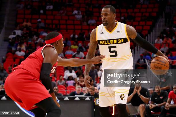 Stephen Jackson of the Killer 3's dribbles the ball while being guarded by Derrick Byars of Trilogy during BIG3 - Week Four at Little Caesars Arena...