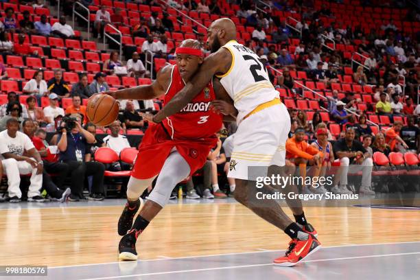 Al Harrington of Trilogy dribbles the ball while being guarded by Josh Powell of the Killer 3's during BIG3 - Week Four at Little Caesars Arena on...