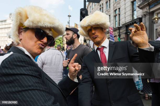 Two men dressed as Donald Trump take part in Together Against Trump march through central London followed by a rally in Trafalgar Square as the...