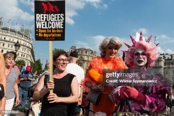 Drag queen protesters joined over 250,000 people taking part in Together Against Trump march through central London followed by a rally in Trafalgar...