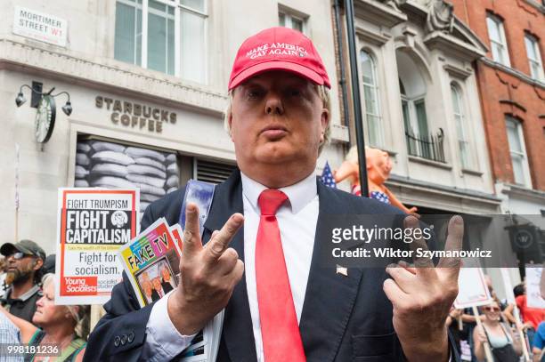 Man dressed as Donald Trump takes part in Together Against Trump march through central London followed by a rally in Trafalgar Square as the...
