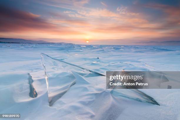 sunset on the ice of lake baikal - olkhon island stock pictures, royalty-free photos & images