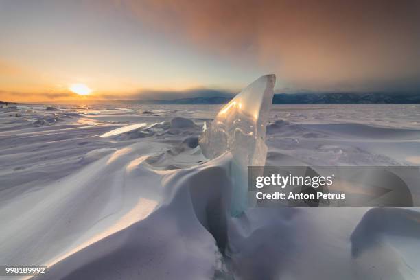 sunset on the ice of lake baikal - irkutsk stock pictures, royalty-free photos & images