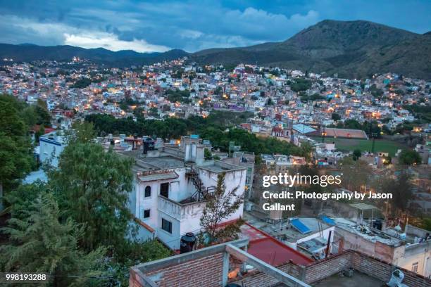 nightime view looking down on guanajuato city from above. - guanajuato state stock pictures, royalty-free photos & images