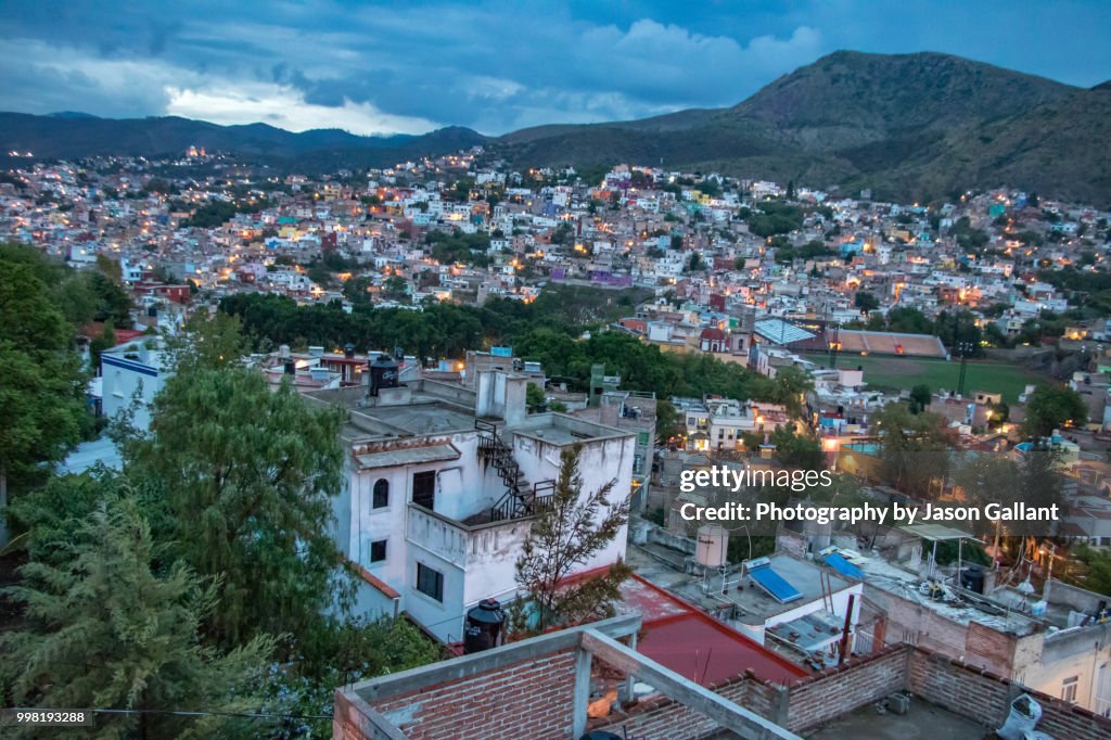 Nightime view looking down on Guanajuato City from above.