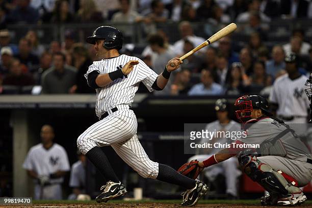 Francisco Cervelli of the New York Yankees hits a one-run RBI off in the first inning against the Boston Red Sox on May 17, 2010 at Yankee Stadium in...