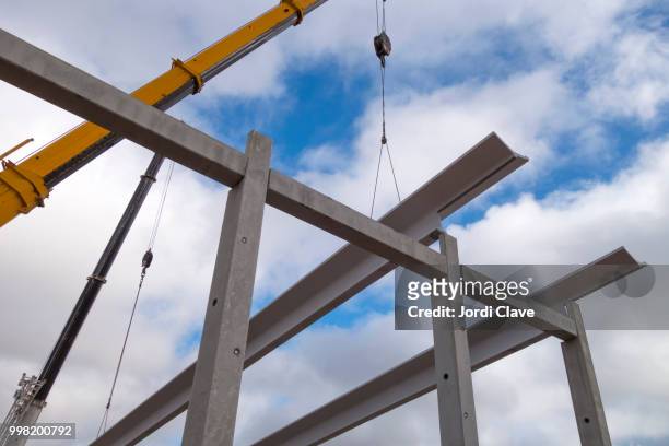 crane working in the construction site - clave stock pictures, royalty-free photos & images