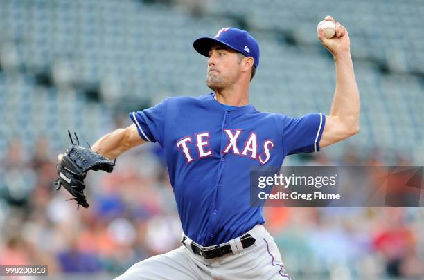 Cole Hamels of the Texas Rangers pitches in the first inning against the Baltimore Orioles at Oriole Park at Camden Yards on July 13, 2018 in...