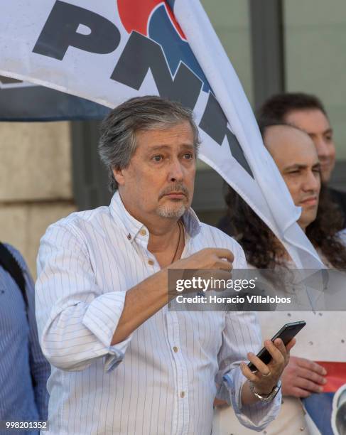 President of the far-right National Renovator Party PNR Jose Pinto Coelho and few followers try to disrupt the protest against "acts of racism that...