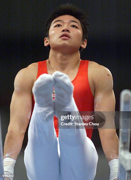 Ooi Wei Siang of Malaysia in action during Rotation 4 at the Parallel Bars during the Men's Gymnastic Working Order Final held at the Putra Stadium,...