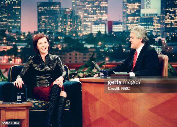Episode 1669 -- Pictured: Actress Charlize Theron during an interview with host Jay Leno on August 23, 1999 --