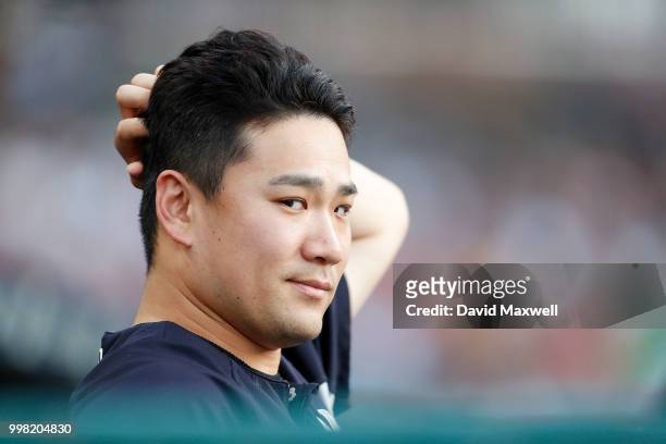 Masahiro Tanaka of the New York Yankees watches from the dugout during the third inning against the Cleveland Indians at Progressive Field on July...