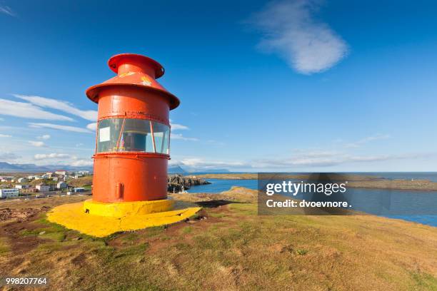 red lighthouse above stykkisholmur, iceland - red beacon stock pictures, royalty-free photos & images