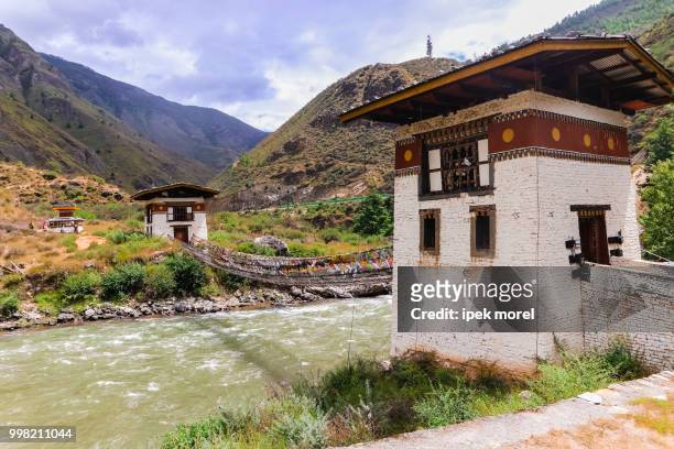 iron bridge of tamchog lhakhang monastery, paro river, bhutan. - ipek morel stock pictures, royalty-free photos & images