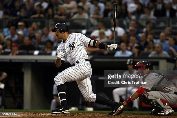 Alex Rodriguez of the New York Yankees hits a two-run RBI off a single in the first inning against the Boston Red Sox on May 17, 2010 at Yankee...